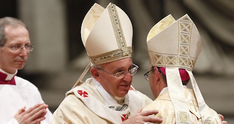Pope embraces new bishop during episcopal ordination in St. Peter's Basilica at Vatican