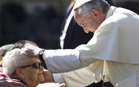 Pope greets woman during general audience in St. Peter's Square at Vatican