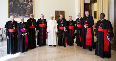 Pope Francis poses with cardinal advisers during meeting at Vatican