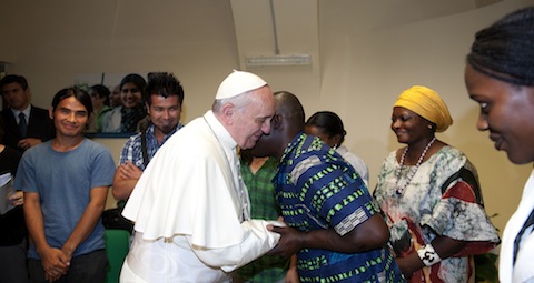 Pope greets people during visit to Astalli Center of Jesuit Refugee Service