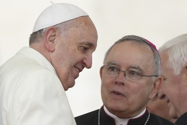 Pope Francis talks with Archbishop Chaput during general audience in St. Peter's Square at Vatican