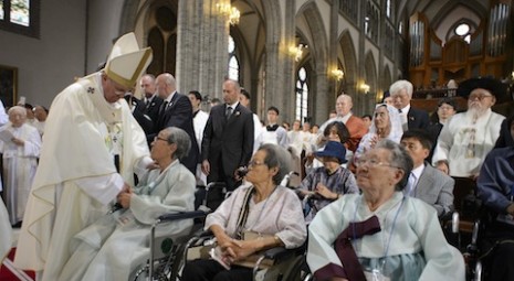 Pope Francis greets 'comfort women' as he arrives to celebrate Mass for peace and for reconciliation of North and South Korea