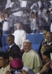 Young people dance as Pope Francis arrives at Villamor Air Base in Manila, Philippines