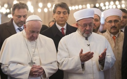 Pope Francis prays with Istanbul's grand mufti during visit to Sultan Ahmed Mosque in Turkey