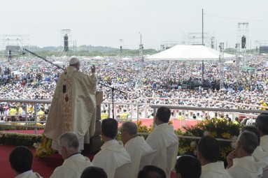 In this pool photo taken on Monday, July 6, 2015 and made available on Tuesday, July 7, 2015, Pope Francis, delivers his speech as he celebrates a Mass at the Samanes park in Guayaquil, Ecuador. Francis is making his first visit as Pope to his Spanish-speaking neighborhood. (L'Osservatore Romano/Pool Photo via AP)