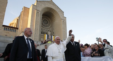 Pope Francis waves as he leaves the Basilica of the National Shrine of the Immaculate Conception after celebrating Mass and the canonization of Junipero Serra Sept. 23 in Washington. (CNS photo/Paul Haring) See POPE-SERRA-MASS Sept. 23, 2015.