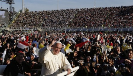Pope Francis greets the crowd as he arrives to celebrate Mass at the Artemio Franchi soccer stadium in Florence, Italy, Nov. 10. Pope Francis also addressed Italy's bishops and cardinals in the Duomo during his one-day visit to Florence. (CNS photo/Paul Haring) See POPE-FLORENCE-MASS Nov. 10, 2015.