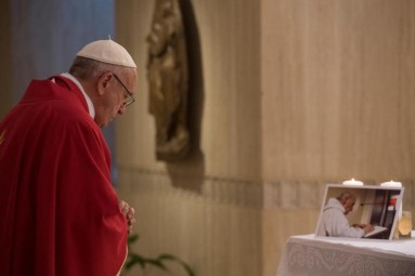 Pope Francis celebrates a memorial Mass for Father Jacques Hamel in the chapel of the Domus Sanctae Marthae at the Vatican Sept. 14. Father Hamel, seen in the photo on the altar, was murdered while celebrating Mass in Rouen, France, July 26; the two killers  claimed allegiance to the Islamic State group. (CNS photo/L'Osservatore Romano) See POPE-MASS-HAMEL Sept. 14, 2016.