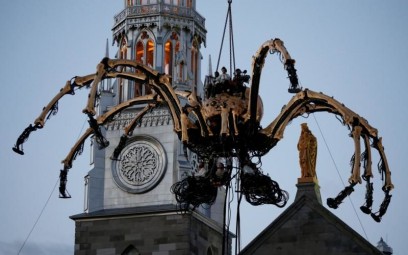 A giant mechanical spider is seen during an art performance in front of Notre-Dame Cathedral Basilica in Ottawa July 27. (CNS photo/Chris Wattie, Reuters) See story to come.