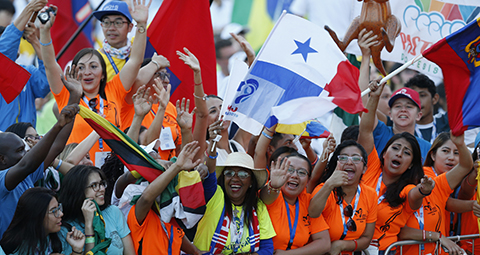 Pilgrims cheer before Pope Francis' celebration of Mass for World Youth Day pilgrims at St. John Paul II Field in Panama City Jan. 27, 2019. (CNS photo/Paul Haring) See POPE-EXHORTATION-YOUNG April 2, 2019.