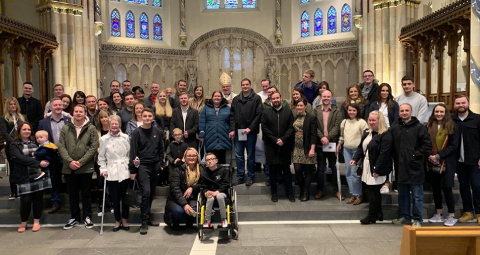 couples with archbishop in cathedral